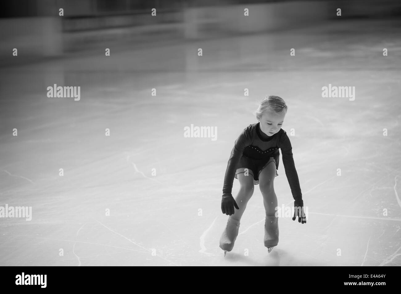 Young female figure skater moving on ice rink at competition Stock Photo Alamy