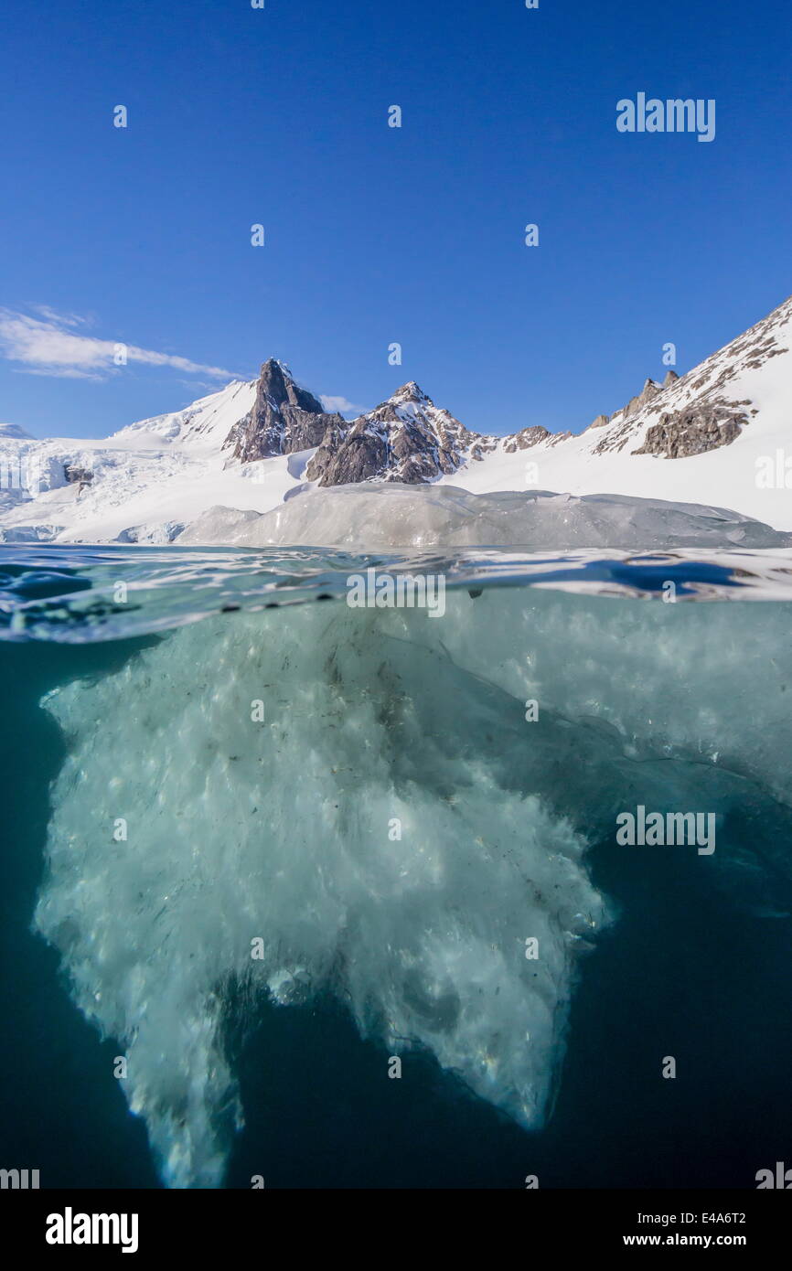 Above and below view of glacial ice in Orne Harbor, Antarctica, Polar Regions Stock Photo