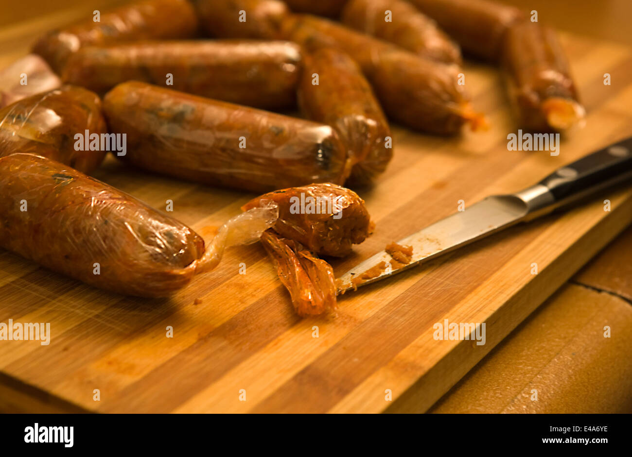 Chorizo or spicy sausage made of boiled vegetables such as marrow, potatoes, onions, pumpkin, et. displayed over a cutting board Stock Photo