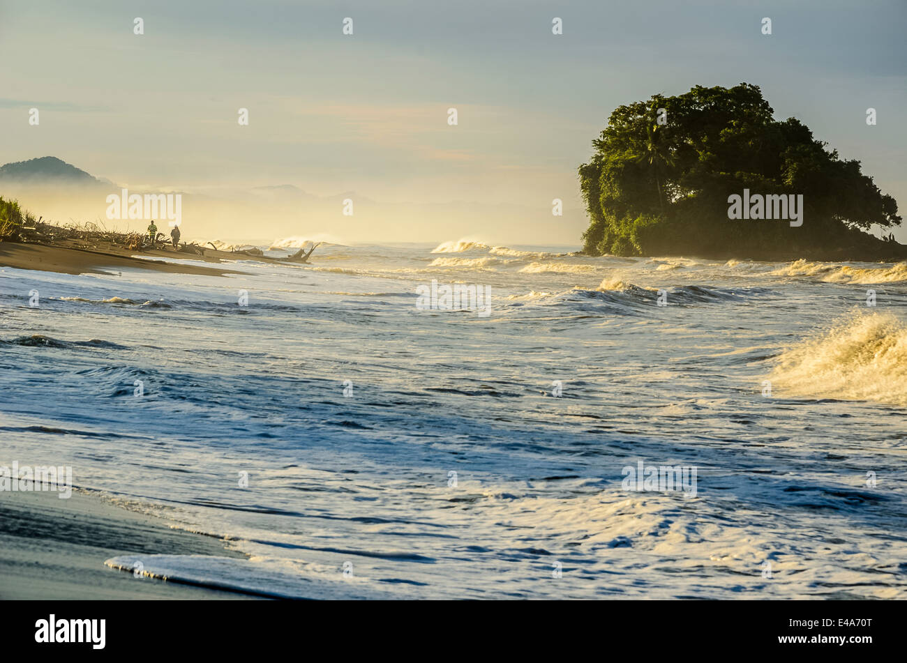 Tourist watching the sunrise on the Bahia Solano beach Stock Photo - Alamy