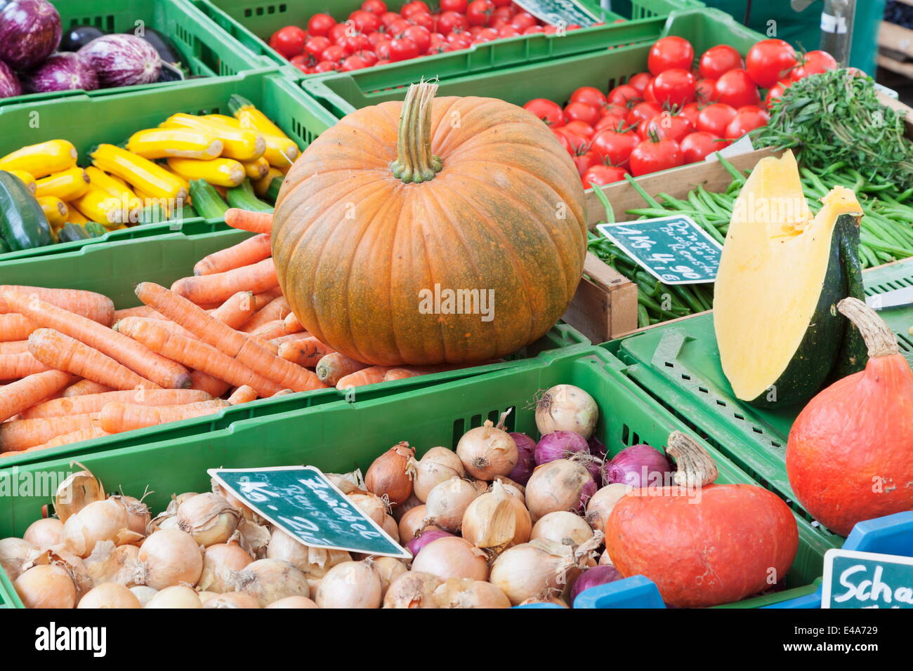 Pumpkin, onions, zucchini (courgettes), carrots, tomatoes and beans at a market stall, Esslingen, Baden Wurttemberg, Germany Stock Photo