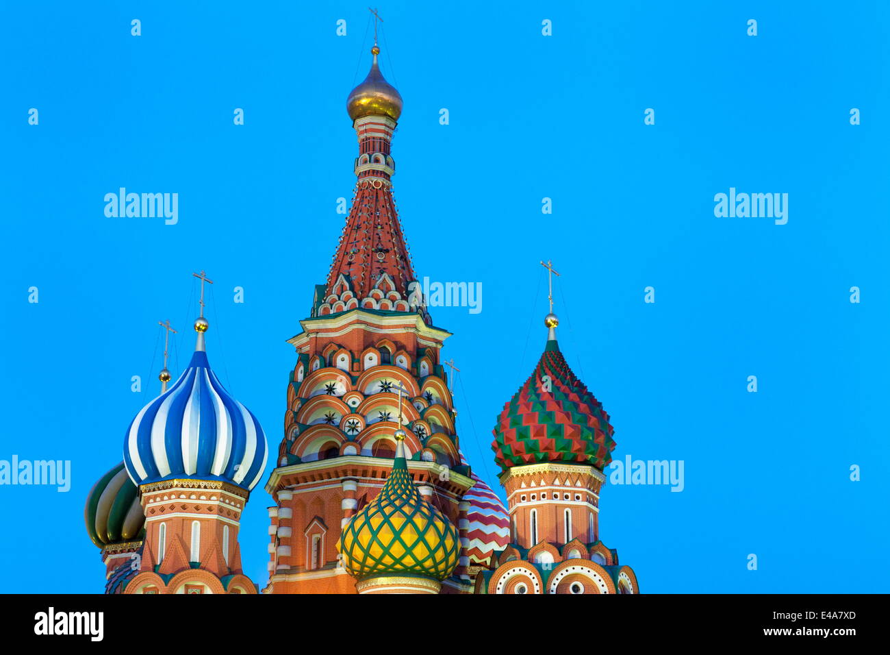Onion domes of St. Basil's Cathedral in Red Square illuminated at night ...