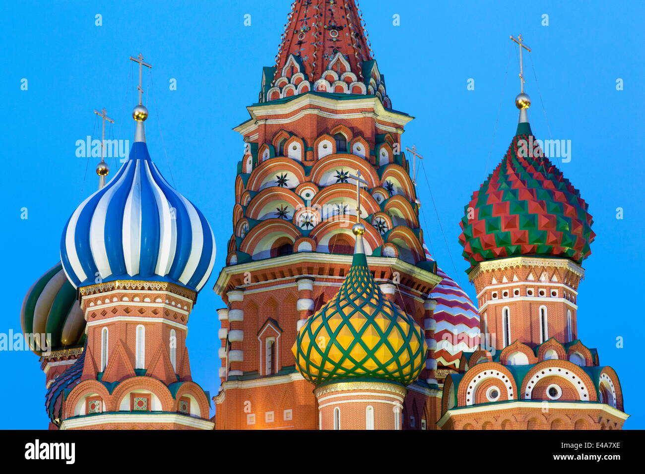 Onion domes of St. Basil's Cathedral in Red Square illuminated in the evening, UNESCO, Moscow, Russia Stock Photo