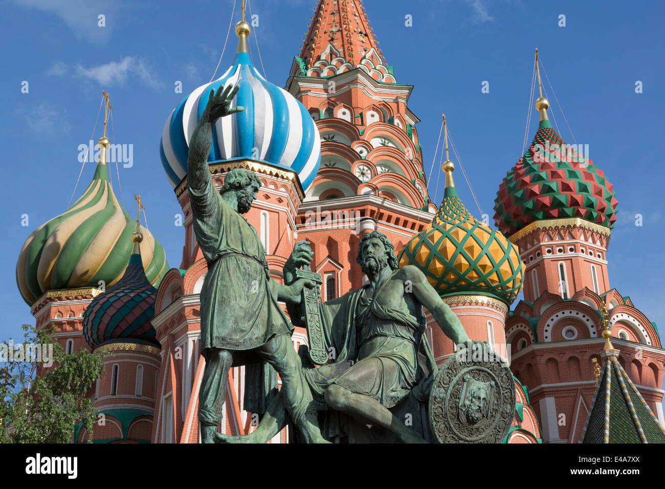 Statue of Minin and Pozharskiy and the onion domes of St. Basil's Cathedral in Red Square, UNESCO, Moscow, Russia Stock Photo