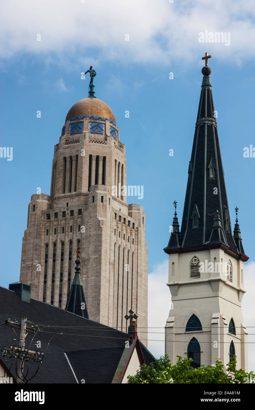 lincoln, nebraska, usa,, the spires of the state capitol building and Saint Marys Catholic Church Stock Photo