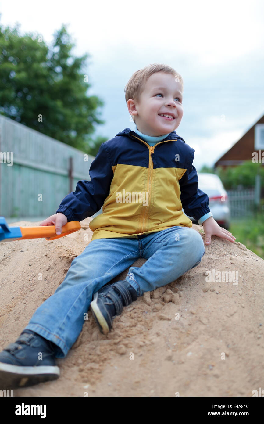 Little boy sitting on sand hi-res stock photography and images - Alamy