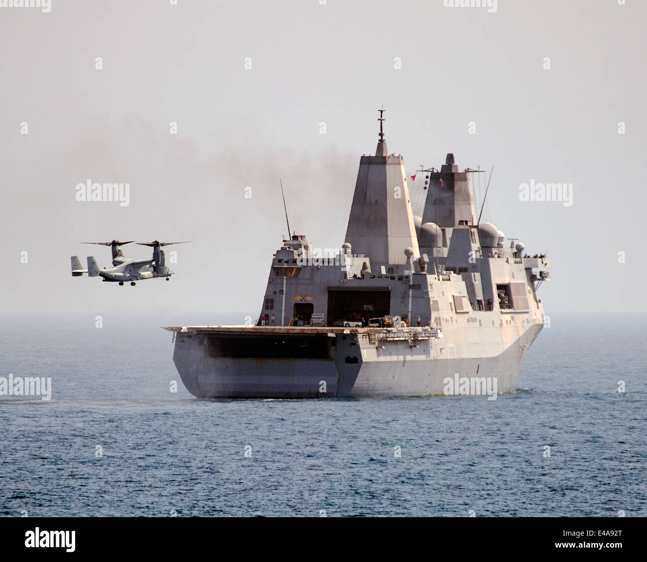 A US Marine Corps MV-22 Osprey aircraft approaches the San Antonio-class amphibious transport dock USS Mesa Verde to land July 02, 2014 in the Persian Gulf. Stock Photo