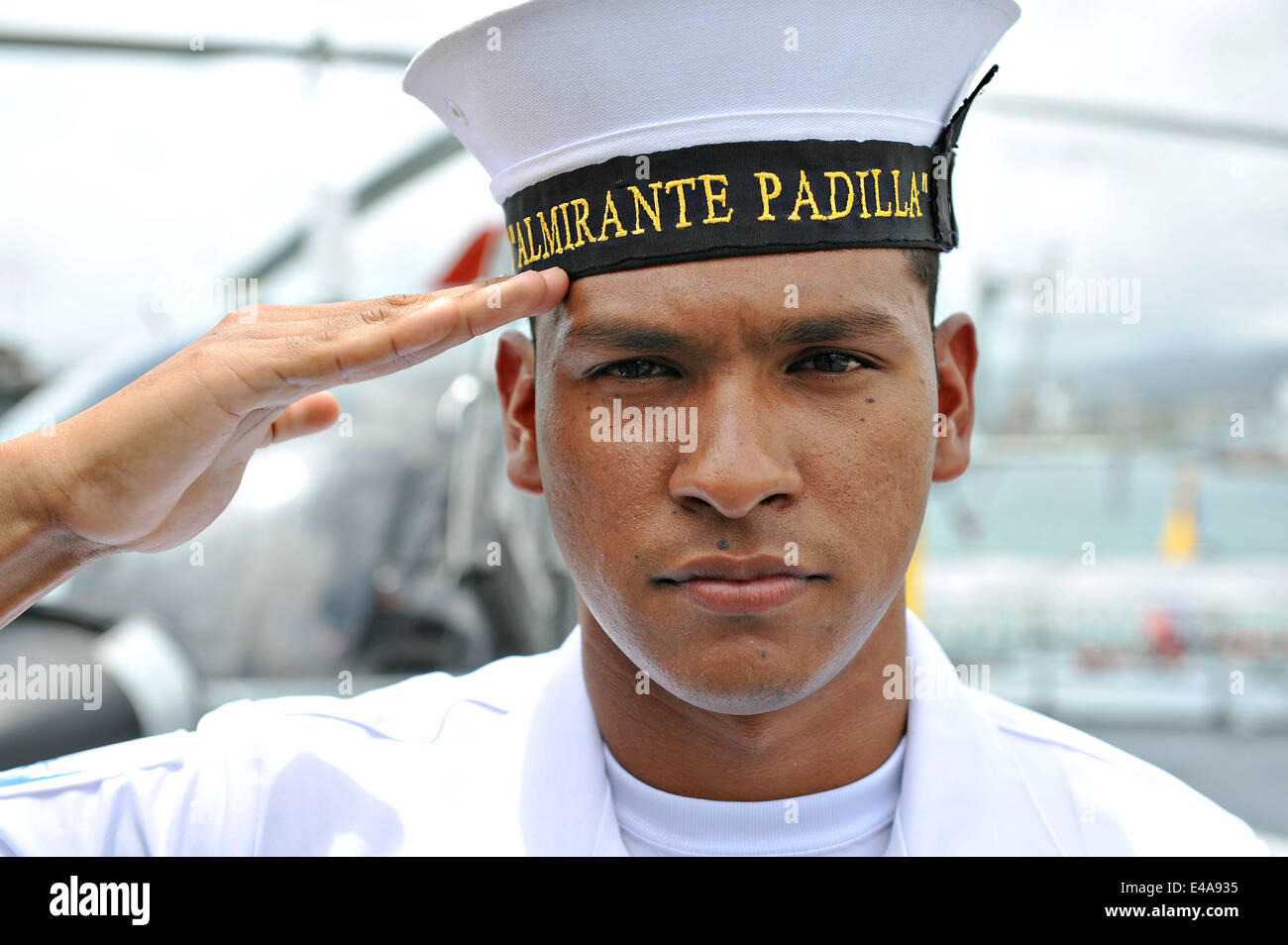 A Colombian Sailor salutes while standing watch aboard the Colombian Navy frigate ARC Almirante Padilla during Rim of the Pacific Exercise July 5, 2014 in Honolulu, Hawaii. Stock Photo