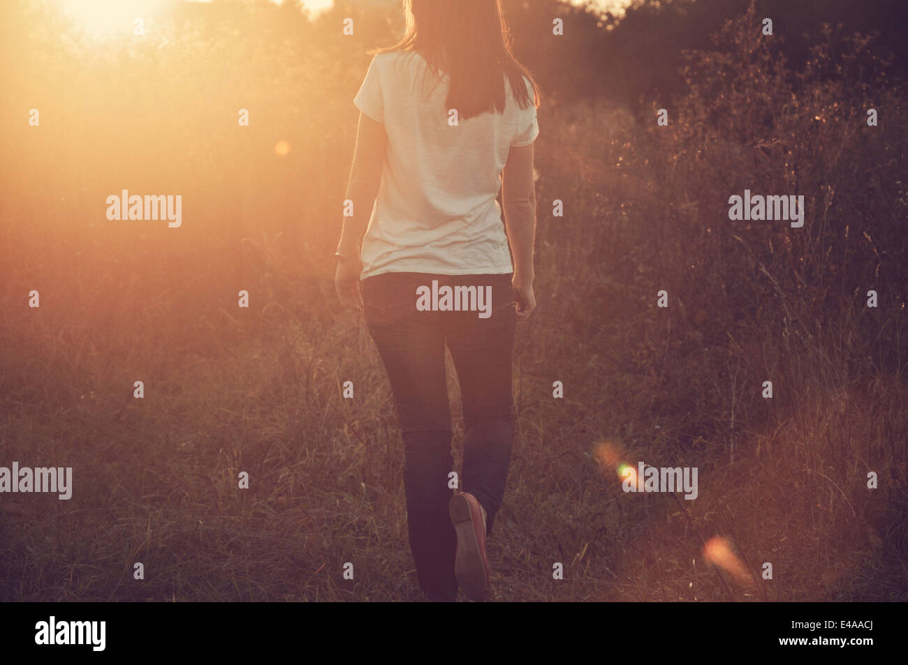 Black woman walking alone hi-res stock photography and images - Alamy