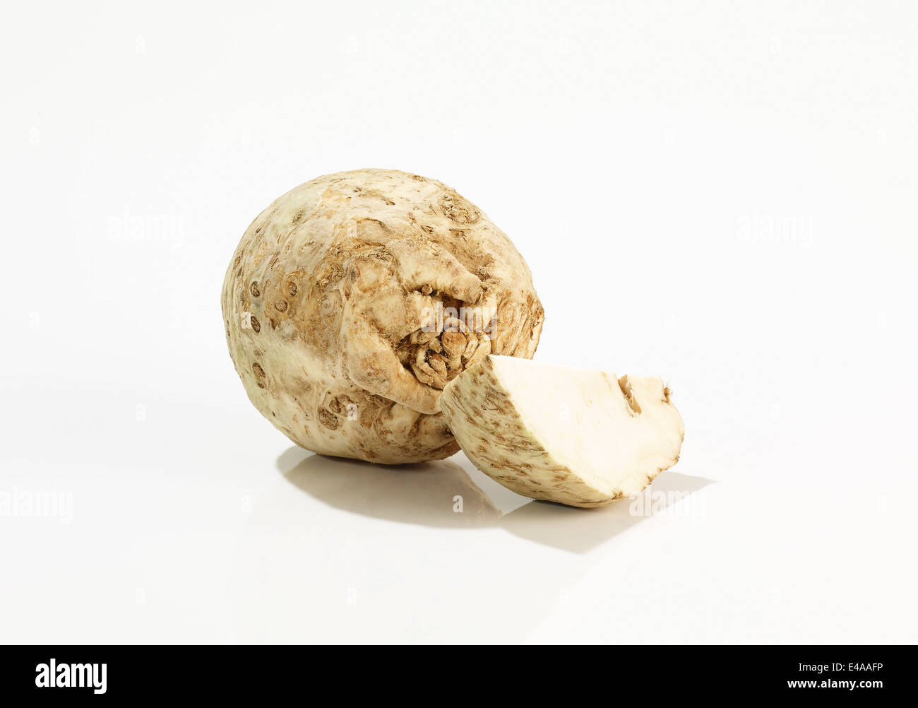 Root celery and piece of celery in front of white background Stock ...