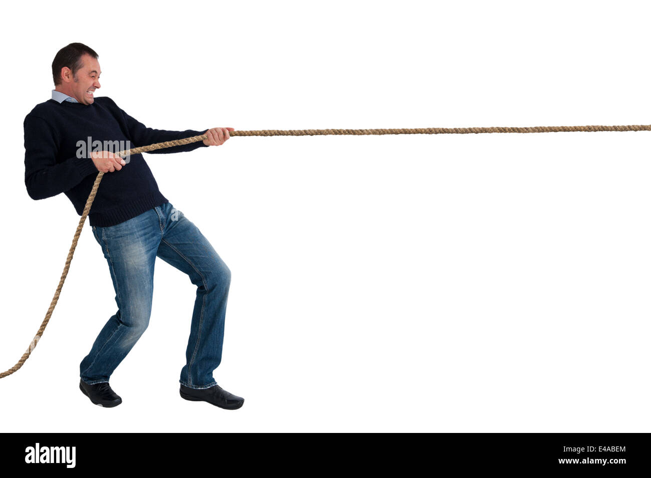 man pulling a rope tug of war isolated white background Stock Photo