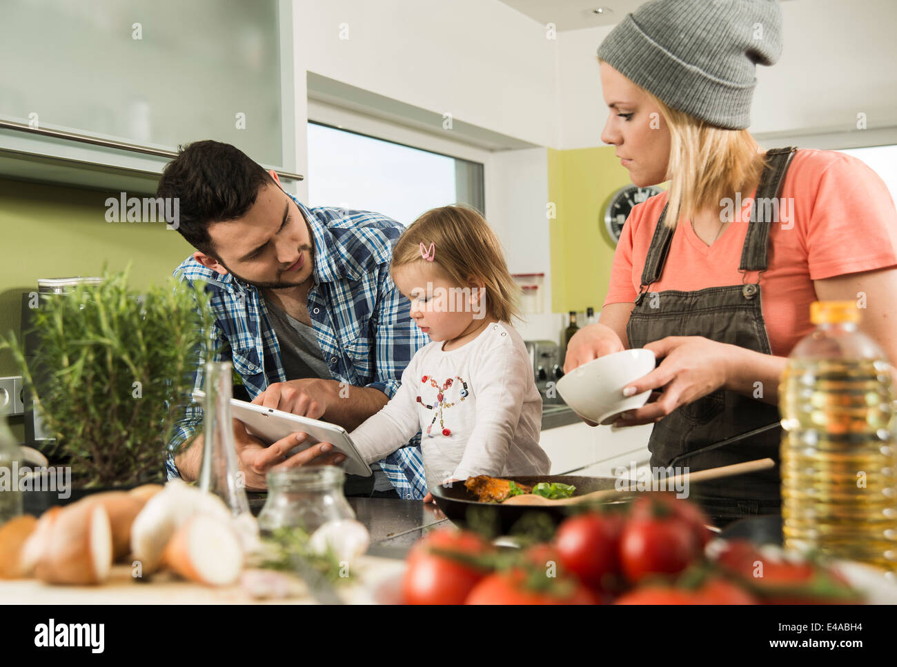 Family cooking in kitchen at home Stock Photo - Alamy
