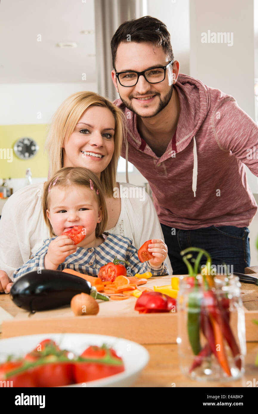 Portrait of family cooking in kitchen at home Stock Photo - Alamy