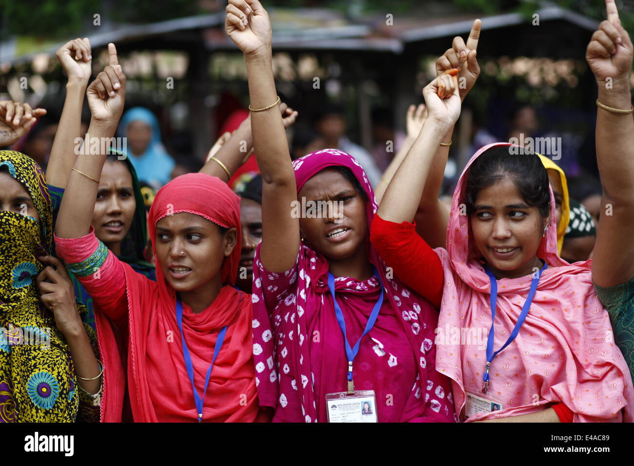 Dhaka, Bangladesh. 7th July, 2014. Bangladeshi garment workers shout slogans during a demonstration in Dhaka. The workers were demanding salary increases and a festival bonus ahead of the Islamic holiday festival Eid-al-Fitr which marks the end of the holy month of Ramadan Credit:  zakir hossain chowdhury zakir/Alamy Live News Stock Photo