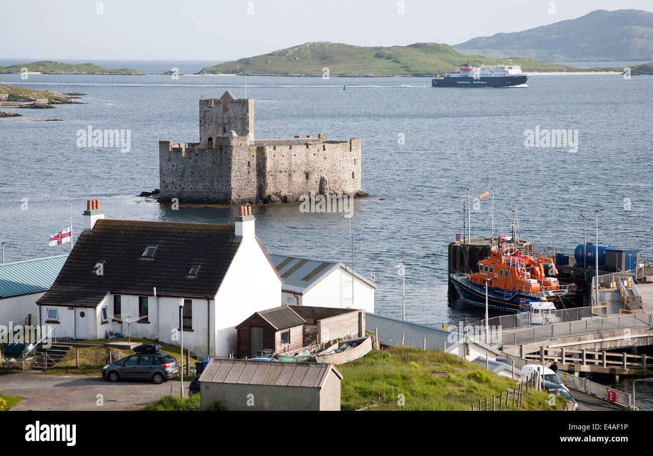Caledonian MacBrayne ferry by Kisimul Castle at Castlebay, Isle of Barra, Outer Hebrides, Scotland Stock Photo