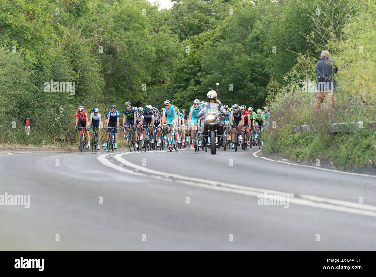 Stapleford near Cambridge, UK. 7th July, 2014.  Competitors in Stage 3 Cambridge to London pass through flat countryside south of Cambridge en route to London. The race attracted thousands of spectators to Cambridge and the route south to Essex and London. Credit:  Julian Eales/Alamy Live News Stock Photo