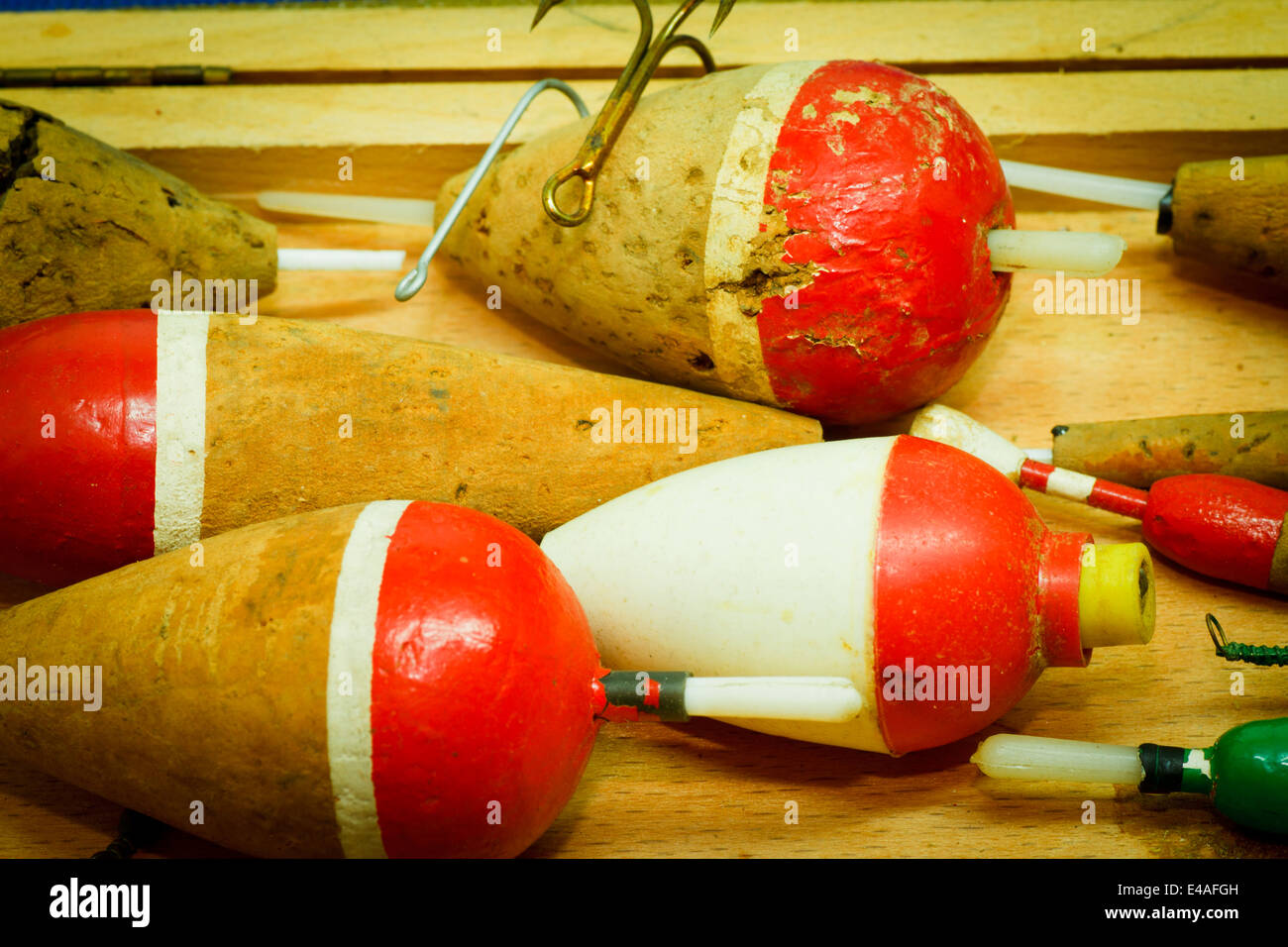https://c8.alamy.com/comp/E4AFGH/old-fishing-buoys-and-fishhooks-on-wooden-background-E4AFGH.jpg