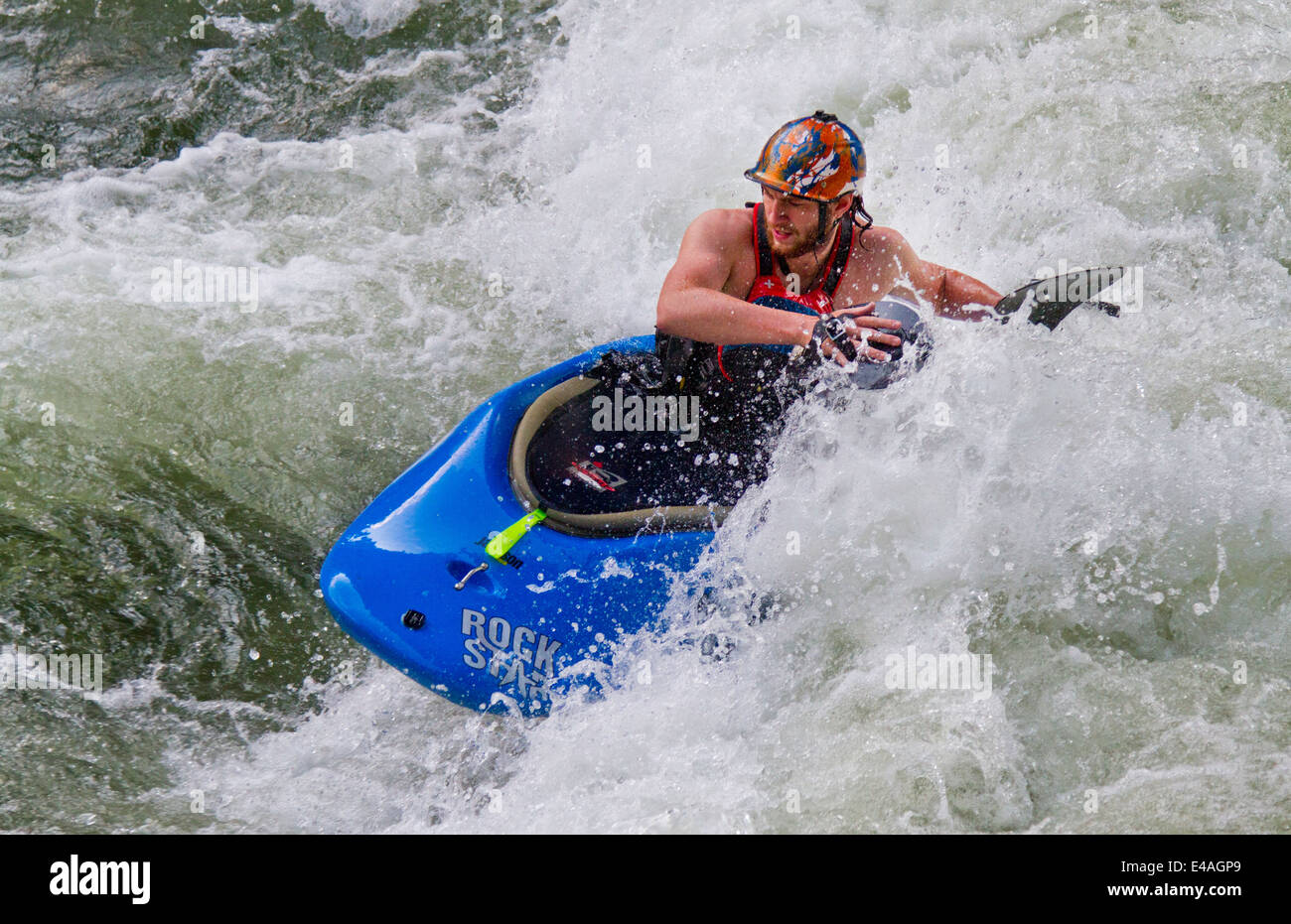 Whitewater kayaker paddling with hand paddles on Ocoee River in