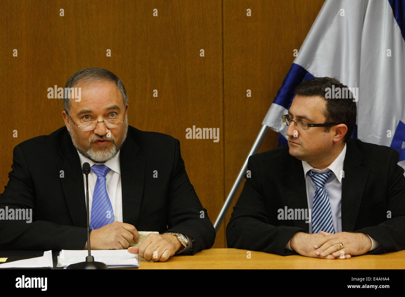 Jerusalem, Israel. 7th July, 2014. Israeli Foreign Minister Avigdor Lieberman (L) attends a news conference at the Knesset (parliament) in Jerusalem, on July 7, 2014. Avigdor Lieberman announced on Monday he decided to sever the joint faction he established with Prime Minister Benjamin Netanyahu due to 'fundamental disagreements.' Netanyahu and Lieberman have had disagreements over how Israel should respond to the recent outbreak of violence (among which the kidnap and murder of the three Israeli teens) and volleys of rockets from the Gaza Strip. Credit:  Xinhua/Alamy Live News Stock Photo