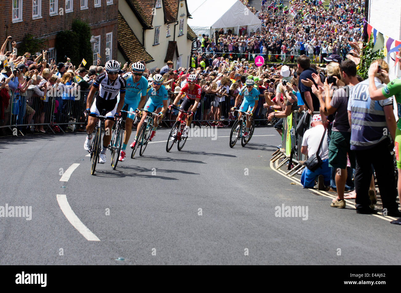 Finchingfield, Essex, UK. 07th July, 2014. The Tour de France stage from Cambridge to London runs through the picturesque Essex village of Finchingfield.  Cyclists race up a hill on Wethersfield Road Credit:  William Edwards/Alamy Live News Stock Photo