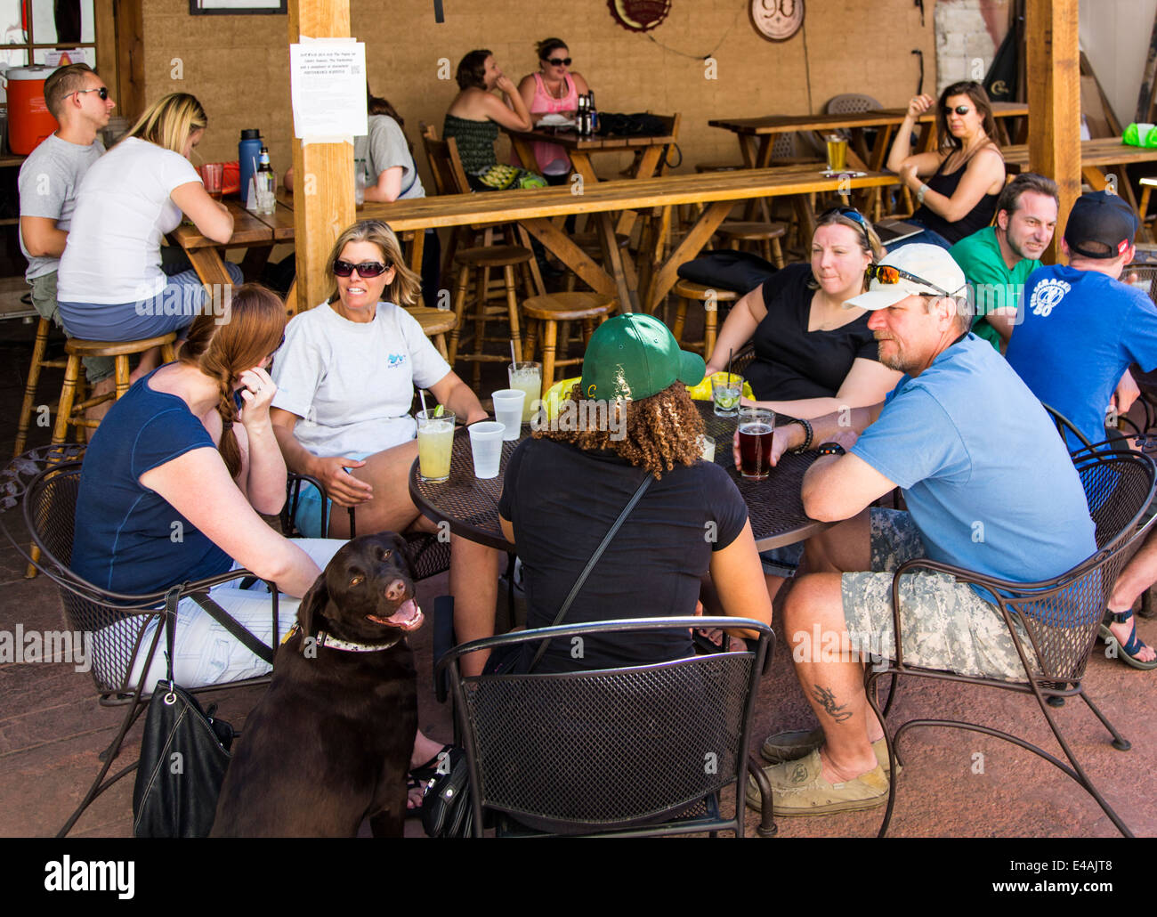 Visitors enjoying food & drink at Benson's Tavern & Beer Garden, an outdoor cafe, during the annual small town ArtWalk Festival Stock Photo