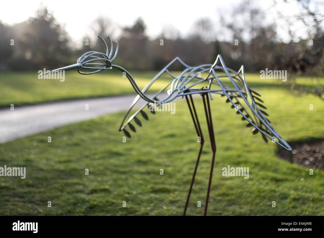 a crane sculpture in a garden Stock Photo Alamy