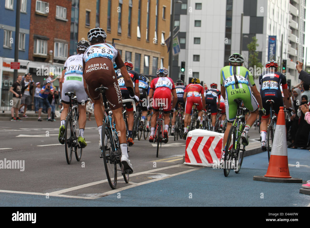 London, UK. 07th July, 2014. Rides make their way through Stratford High Street and onto West Ham Lane on Stage 3 of the Tour de France via Newham. Credit:  Credit:  david mbiyu/Alamy Live News Stock Photo