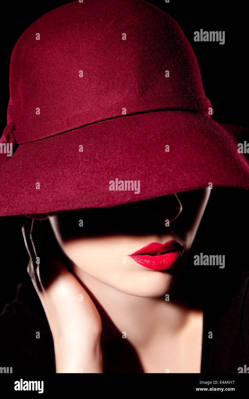 Beautiful woman with hat and red lips Stock Photo - Alamy