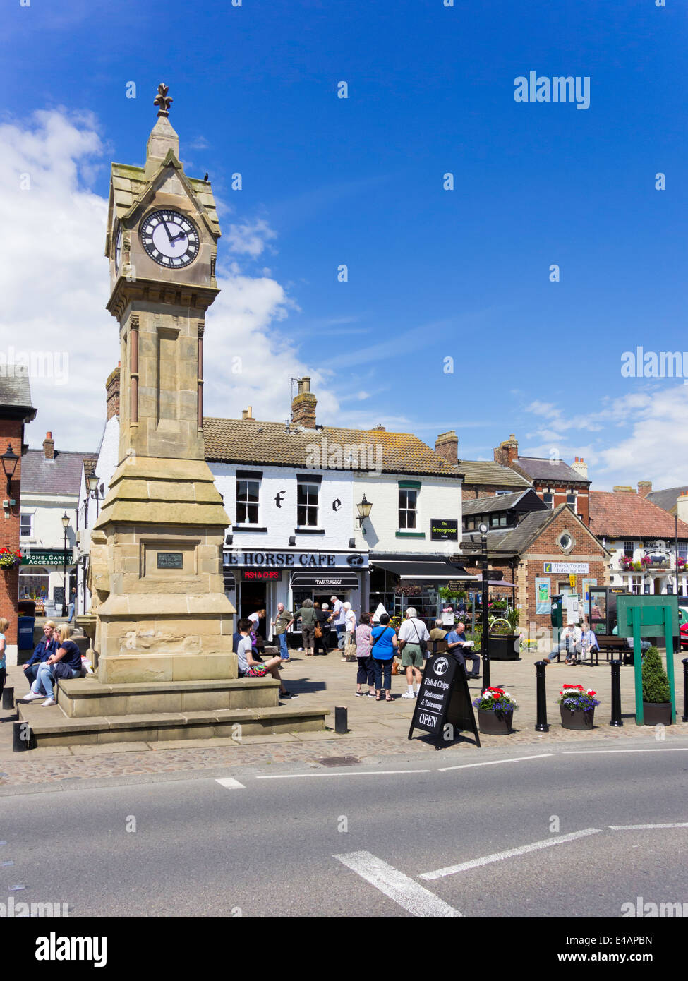 The town clock in the Market Place in Thirsk North Yorkshire UK formerly with trees cut down 2014 to prevent bird nuisance Stock Photo