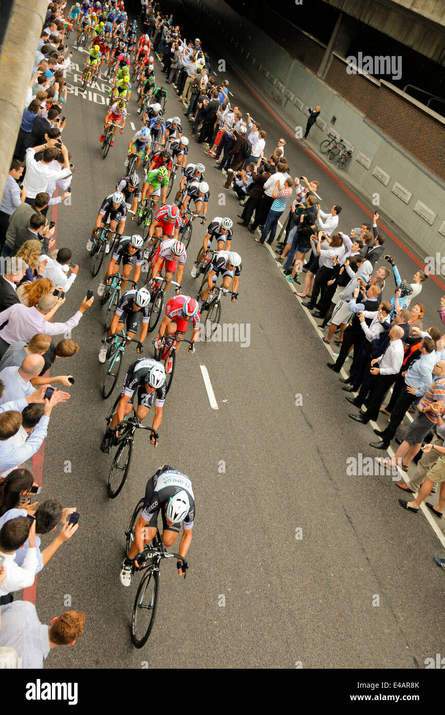 London, UK - 7 July 2014: Omega Pharma Quickstep team leading the peloton passing under Blackfriars Bridge in Tour de France Stock Photo
