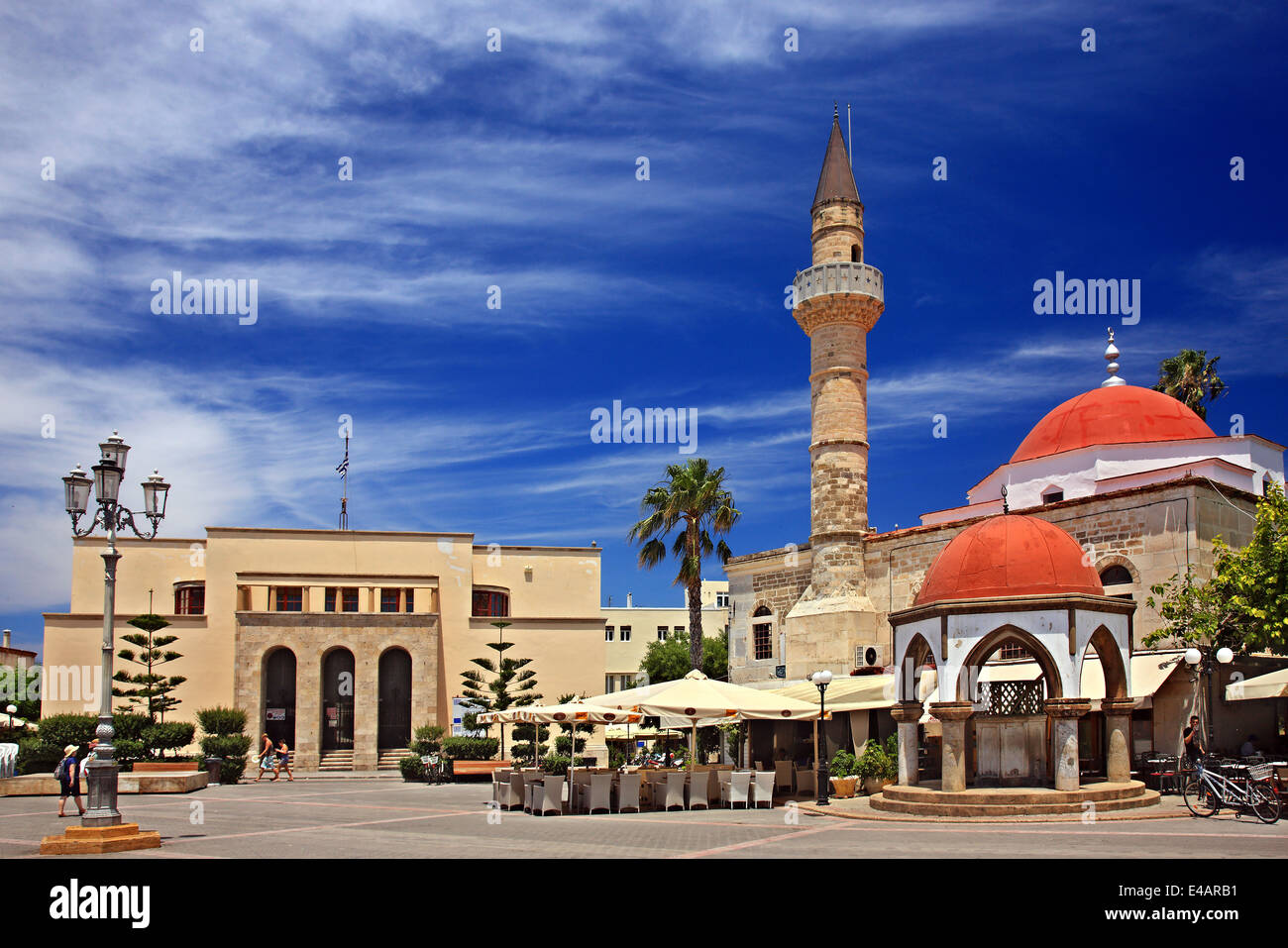 The Defterdar mosque  and the Achaeological Museum (left) at Eleftherias square, Kos town,  Dodecanese, Aegean sea, Greece. Stock Photo