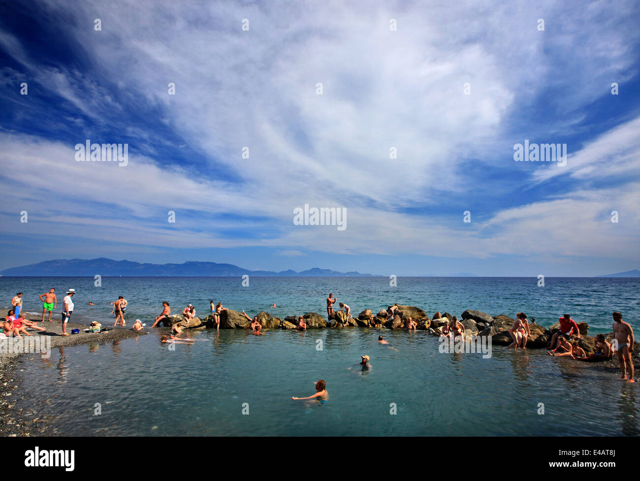 Enjoying a natural spa at the thermal springs of Therma (or 'Empros Thermes') beach, Kos island, Dodecanese, Greece. Stock Photo