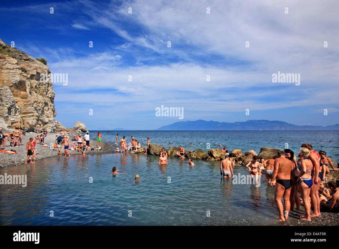 Enjoying a natural spa at the thermal springs of Therma (or 'Empros Thermes') beach, Kos island, Dodecanese, Greece. Stock Photo