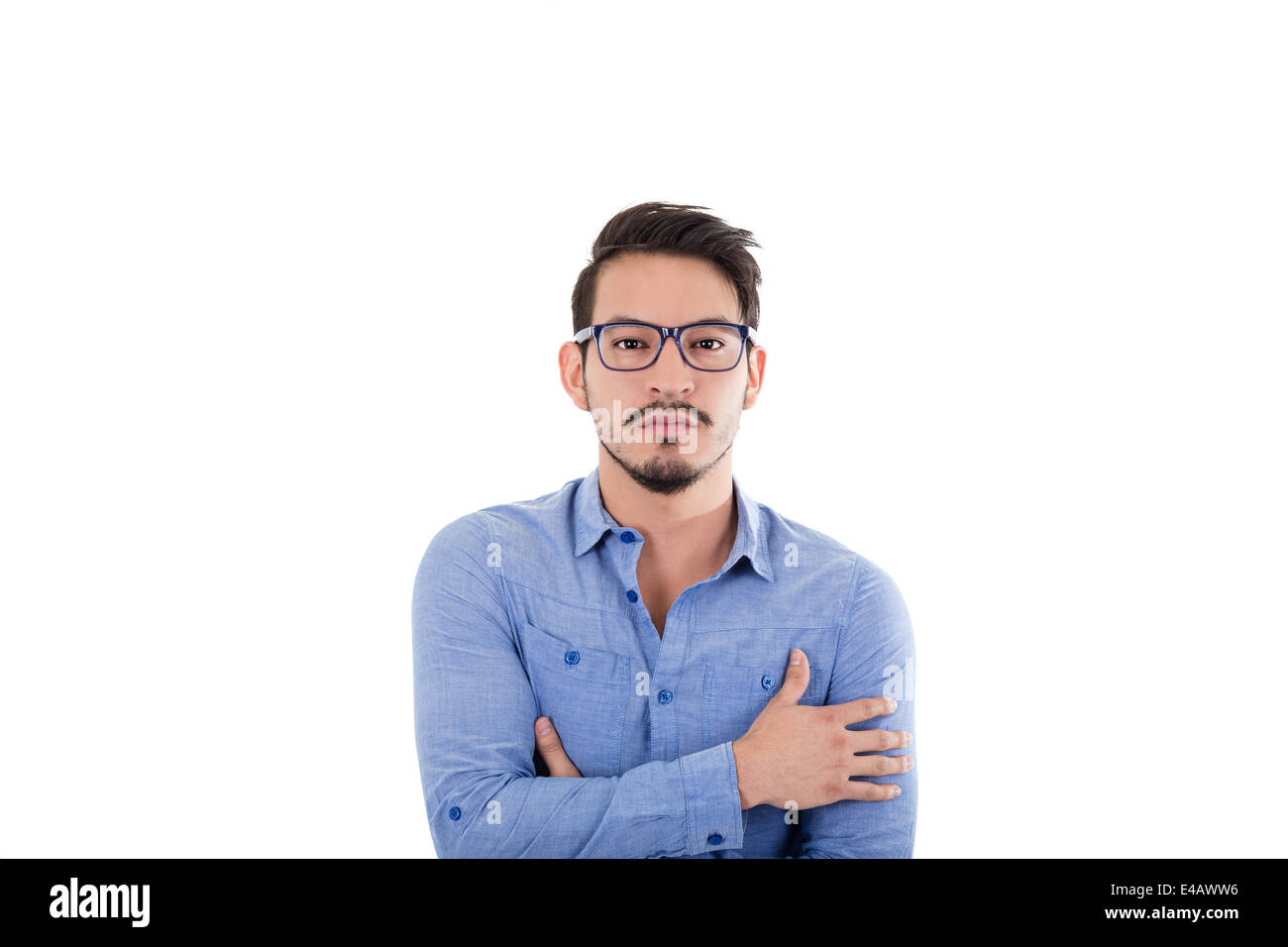 young hispanic man with blue shirt and glasses Stock Photo - Alamy