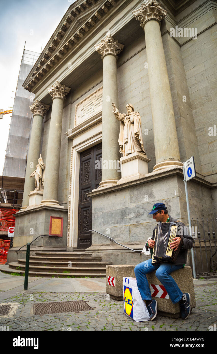 Busker playing accordion in Turin, Piedmont, Italy. Stock Photo