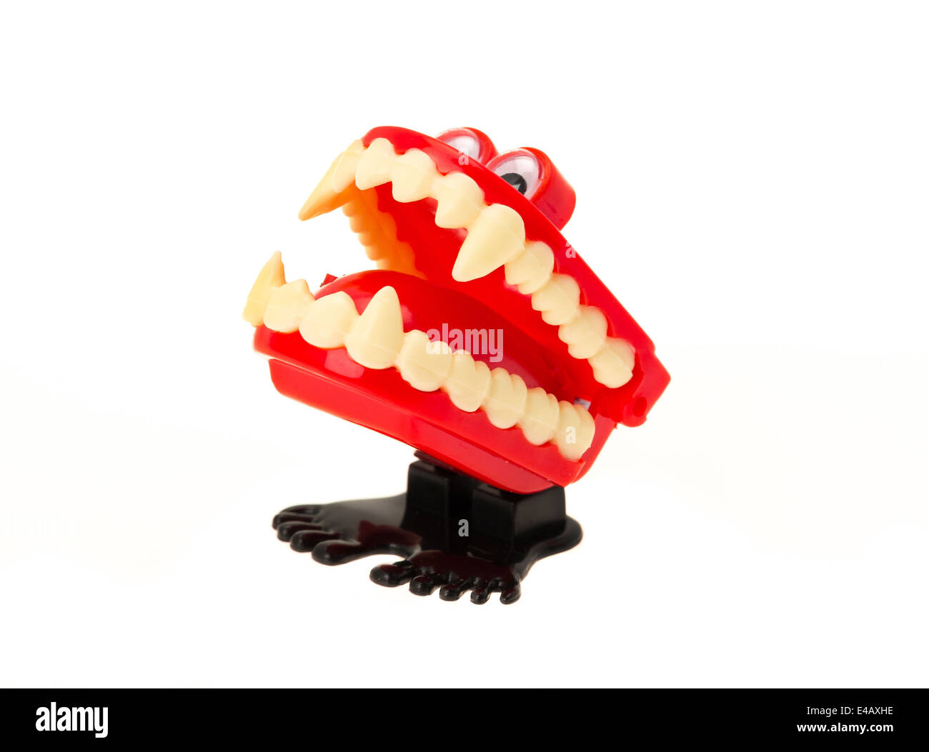 A wind up clockwork toy of funny chattering teeth - studio shot with a white background Stock Photo