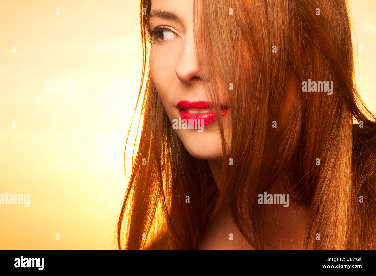 Beautiful, happy young woman in sunlight Stock Photo - Alamy