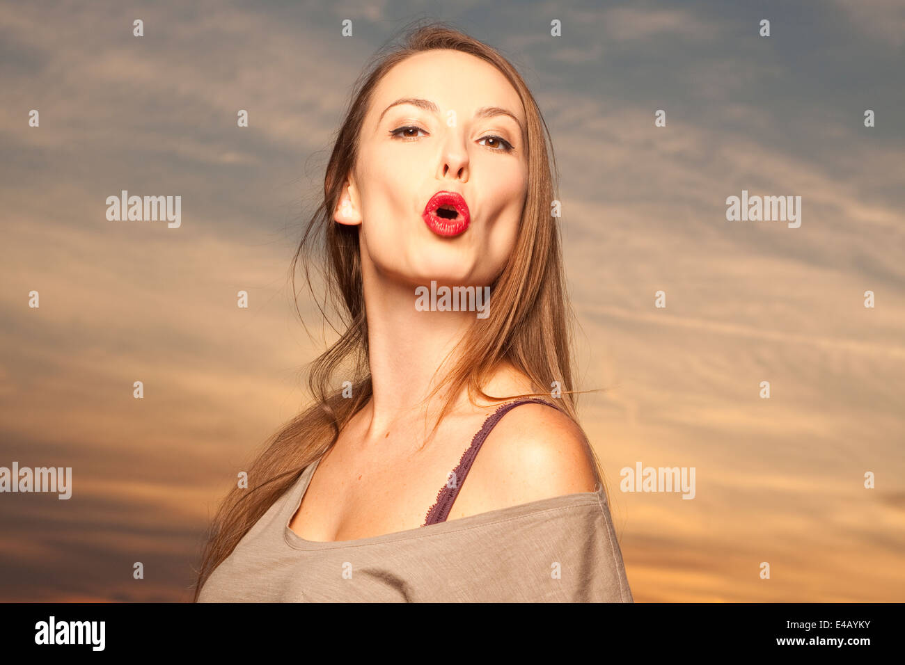 Beautiful, happy young woman in sunlight Stock Photo