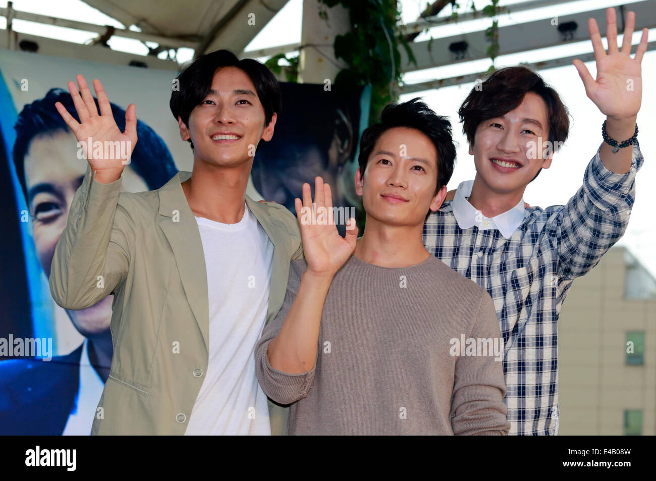 Ju Ji-Hoon, Ji Sung and Lee Kwang-Soo, Jul 4, 2014 : South Korean actors (L-R) Ju Ji-Hoon, Ji Sung and Lee Kwang-Soo wave towards fans during a promotional event for their new movie, Good Friends, in Seoul, South Korea. © Lee Jae-Won/AFLO/Alamy Live News Stock Photo