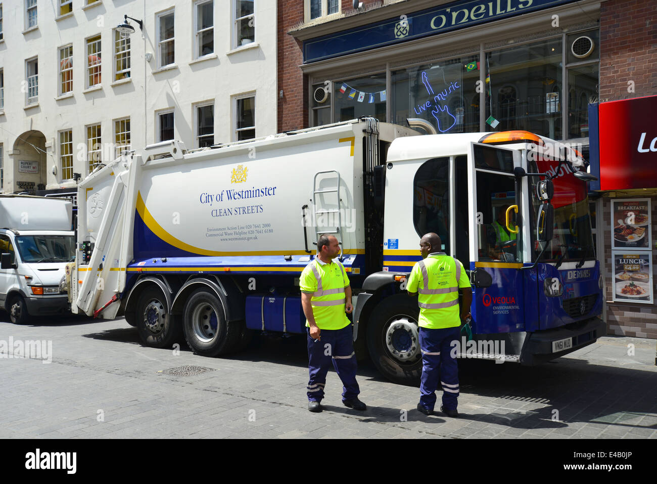 Rubbish truck collection in Wardour Street, Chinatown, West End, City of Westminster, London, England, United Kingdom Stock Photo