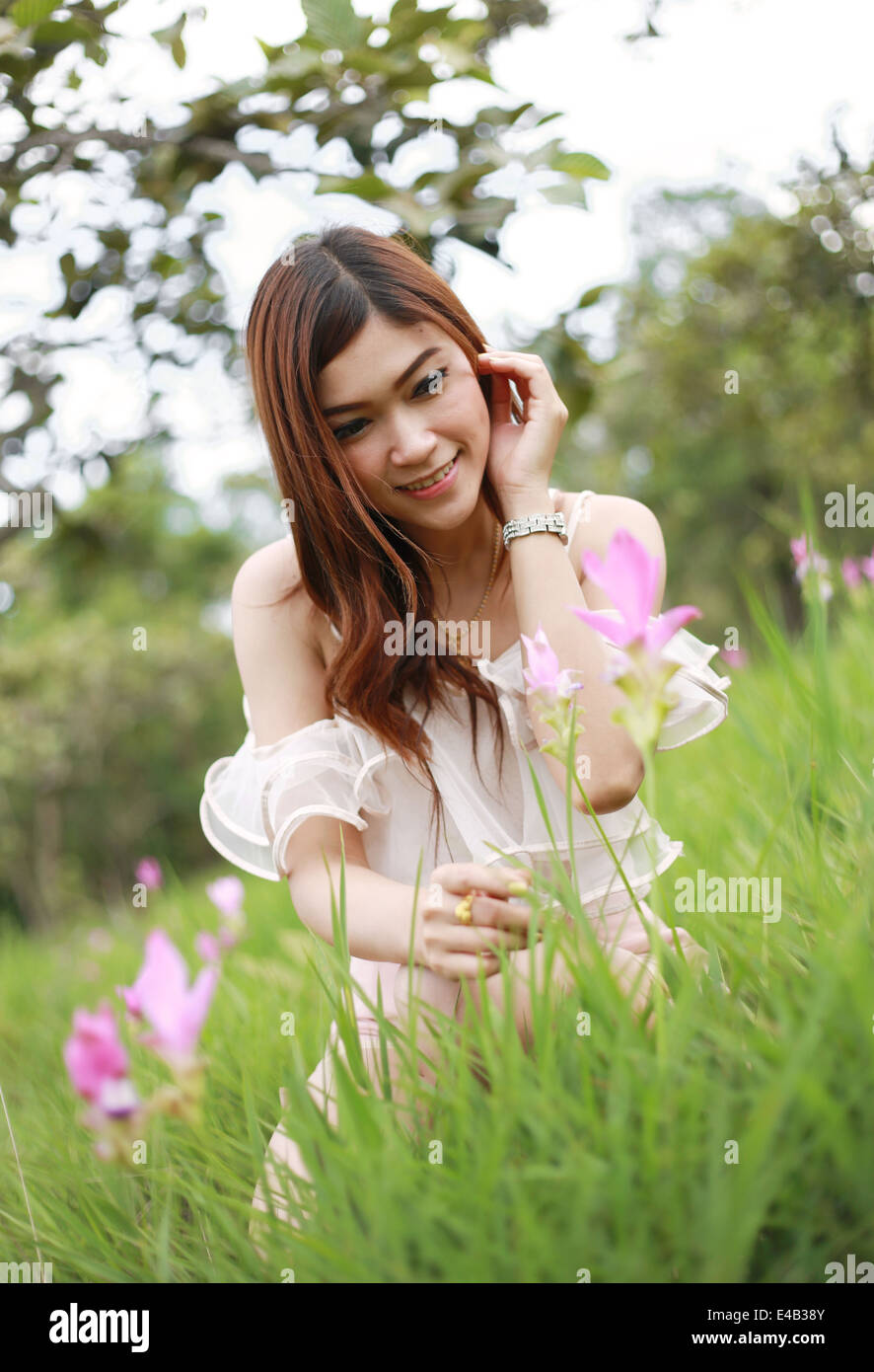 pretty asian woman in siam tulip flower field Stock Photo - Alamy, image size:886x1390