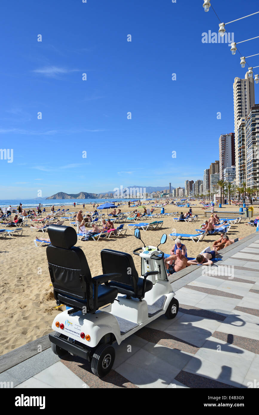 Double mobility scooter on seafront esplanade, Playa de Levante