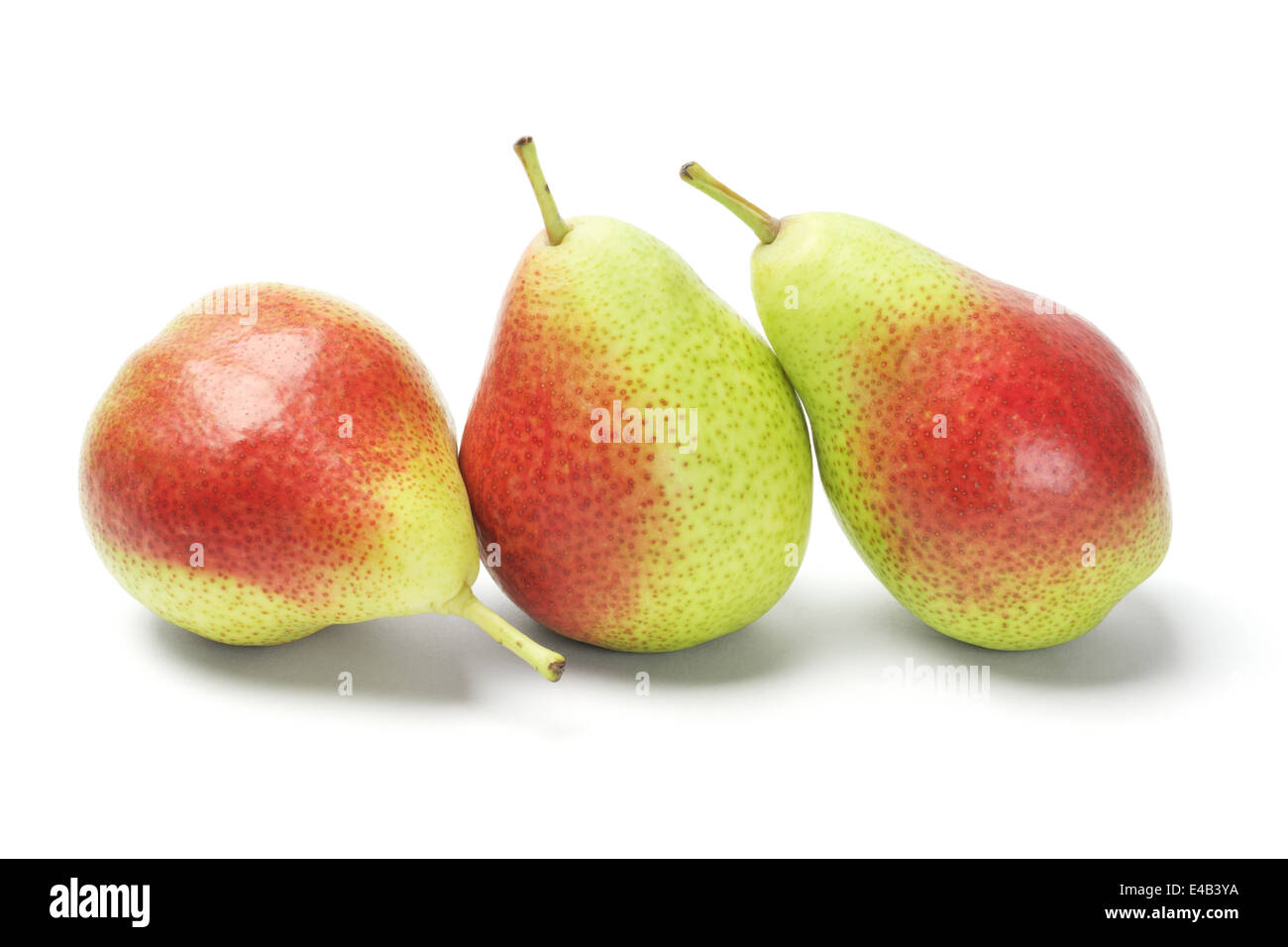 Three Blush Pears In A Row On White Background Stock Photo