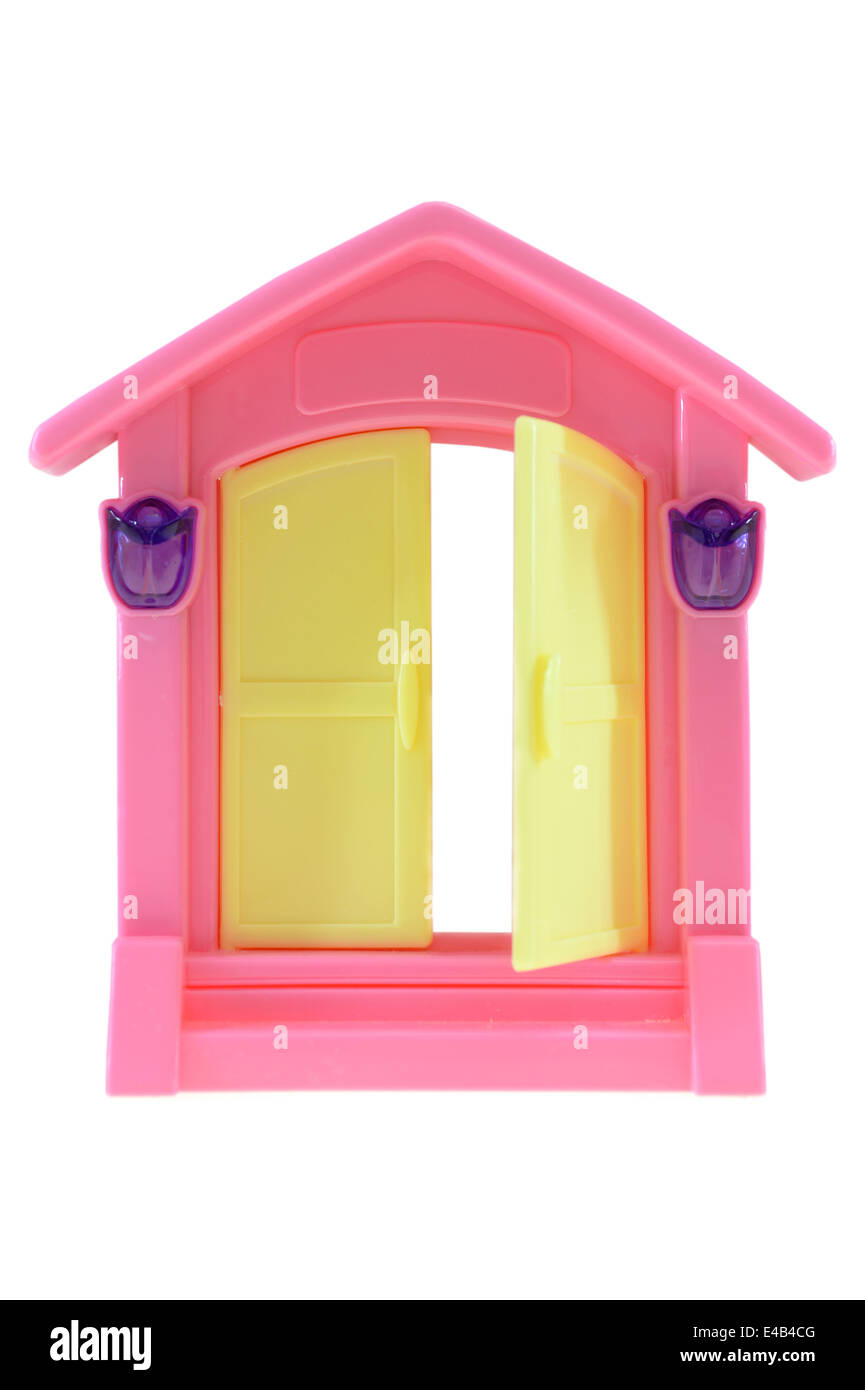 Girl playing with dolls house hi-res stock photography and images - Alamy