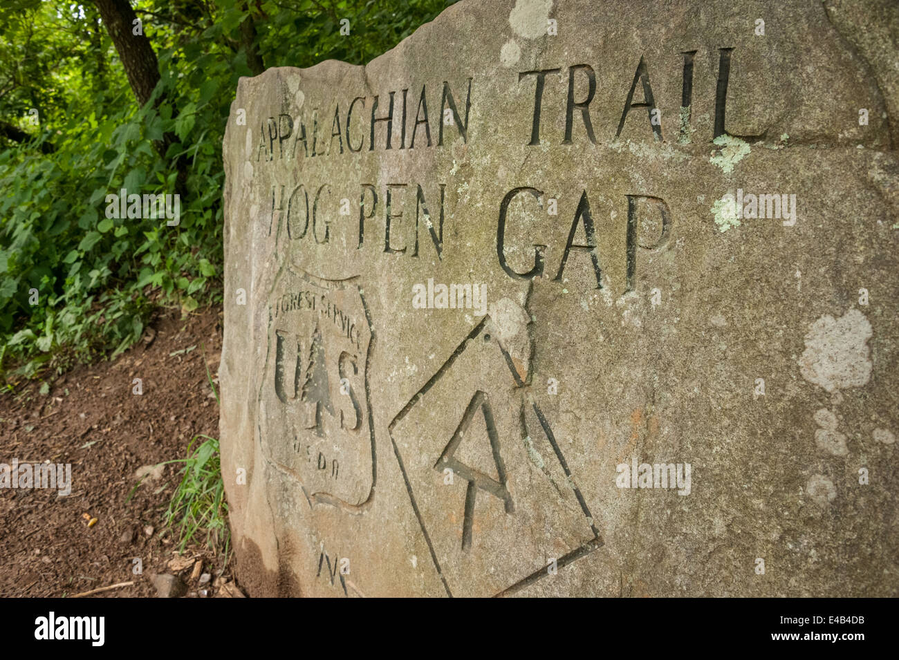 Stone marker where the Appalachian Trail meets the Richard B. Russell Scenic Highway at Hog Pen Gap in North Georgia, USA. Stock Photo