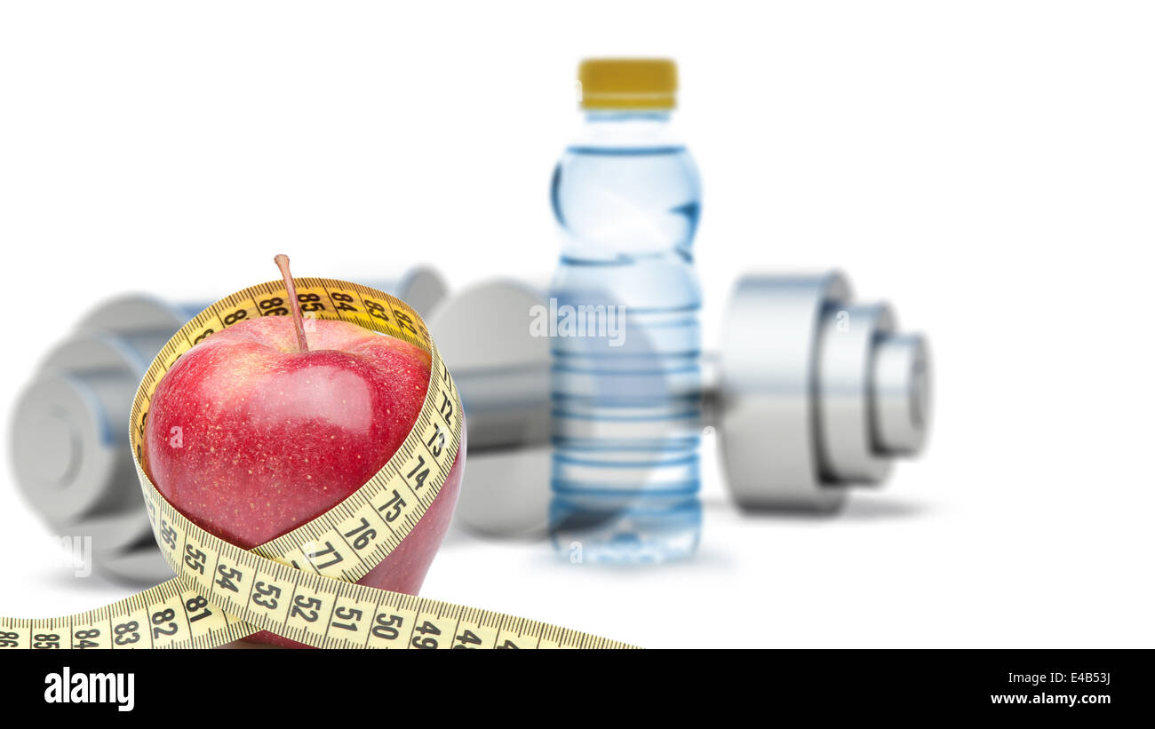 Dumbbells with an apple and measuring type Stock Photo