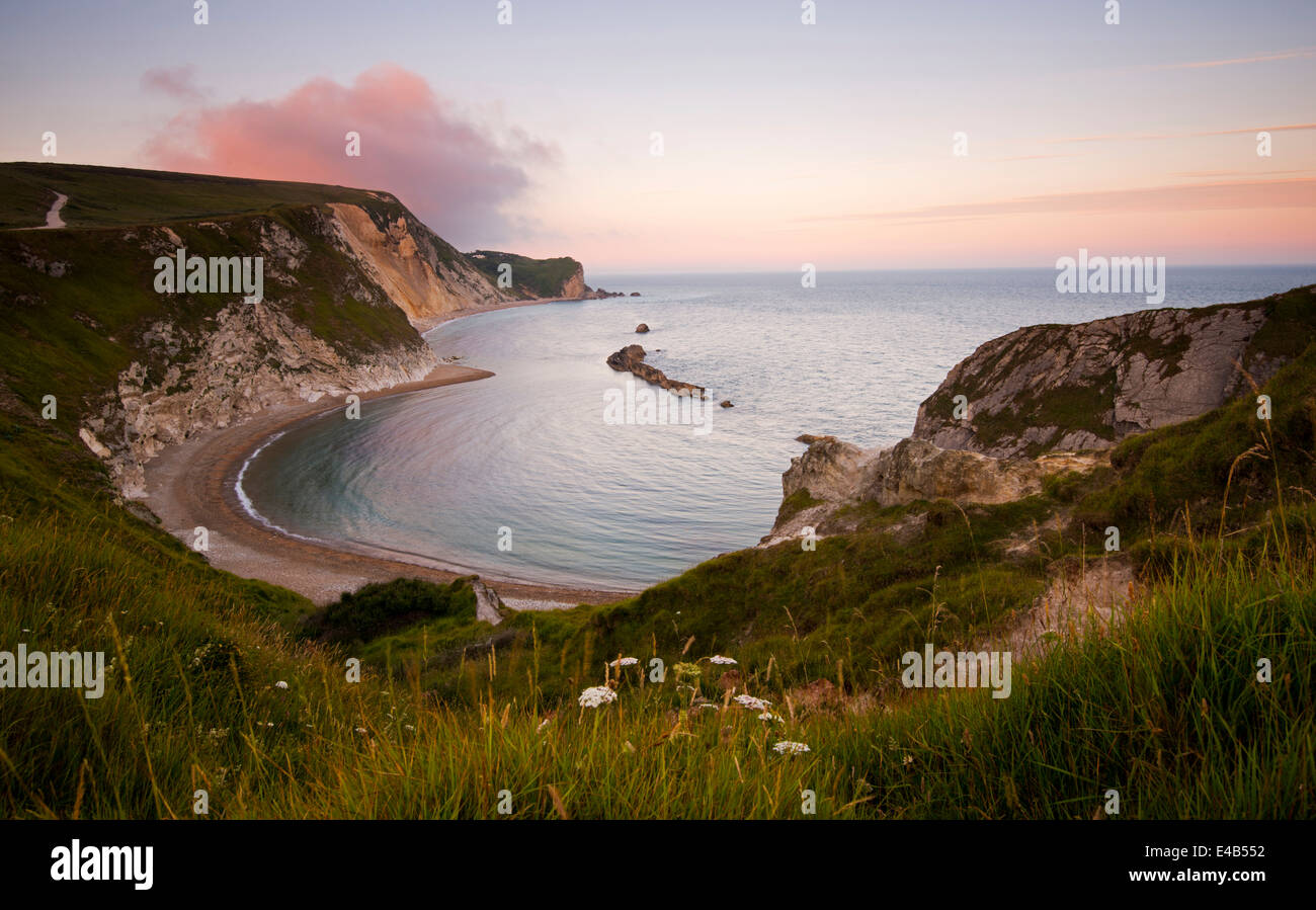 Sunset at Man of War Bay, Lulworth in Dorset England UK Stock Photo