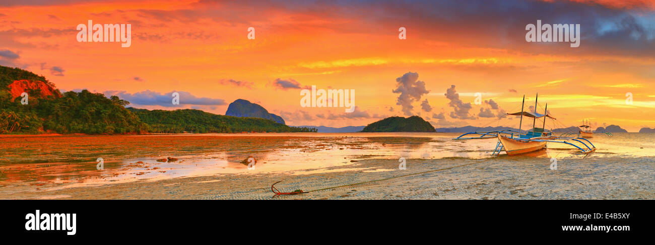 Boat at sunset Stock Photo - Alamy