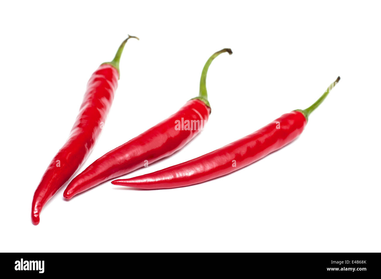 Three white isolated red peppers Stock Photo