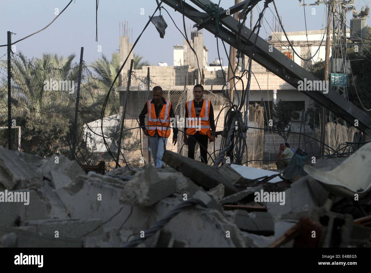 April 16, 2010 - Khan Younis, Gaza Strip, Palestinian Territory - Palestinians of the Civil defense inspect a house which police said was destroyed in an Israeli air strike in Khan Younis in the southern Gaza Strip July 8, 2014. Israel launched an offensive against Islamist Hamas in the Gaza Strip on Tuesday, bombing some 50 targets, including homes, in a campaign meant to end Palestinian rocket fire into the Jewish state. The Israeli military said it targeted about 50 sites in aerial and naval assaults. Palestinian officials said more than 30 of them were bombed in little more than an hour be Stock Photo